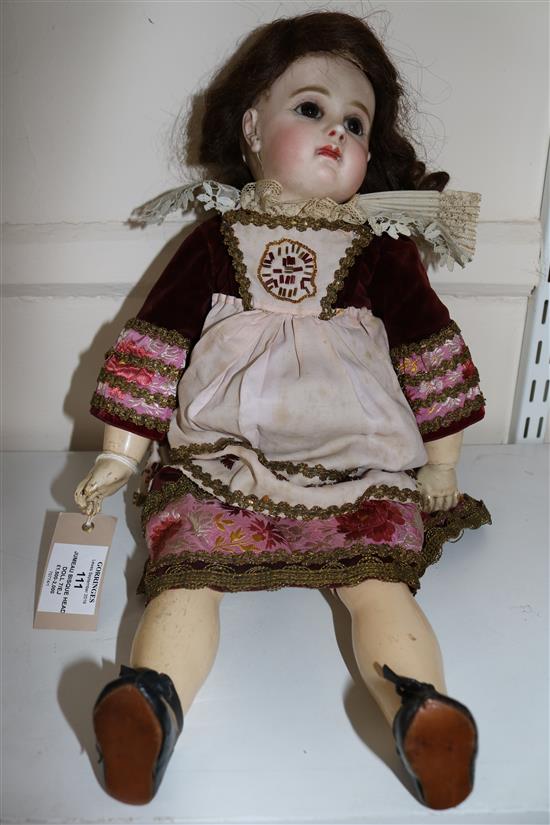 A Jumeau bisque head doll, stamped 7EJ, late 19th century, height 17.5in., small firing crack to right ear